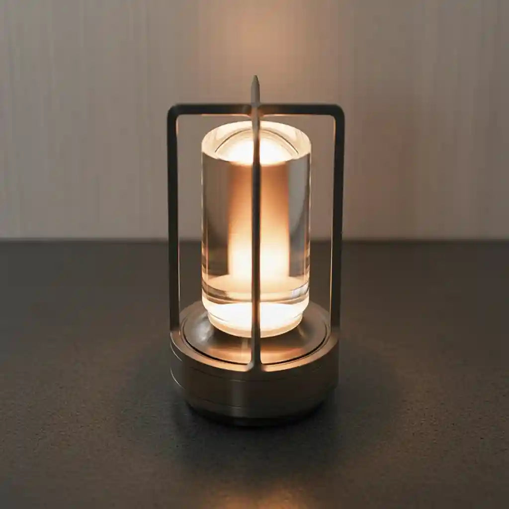Modern candle holder with a lit candle on a dark surface