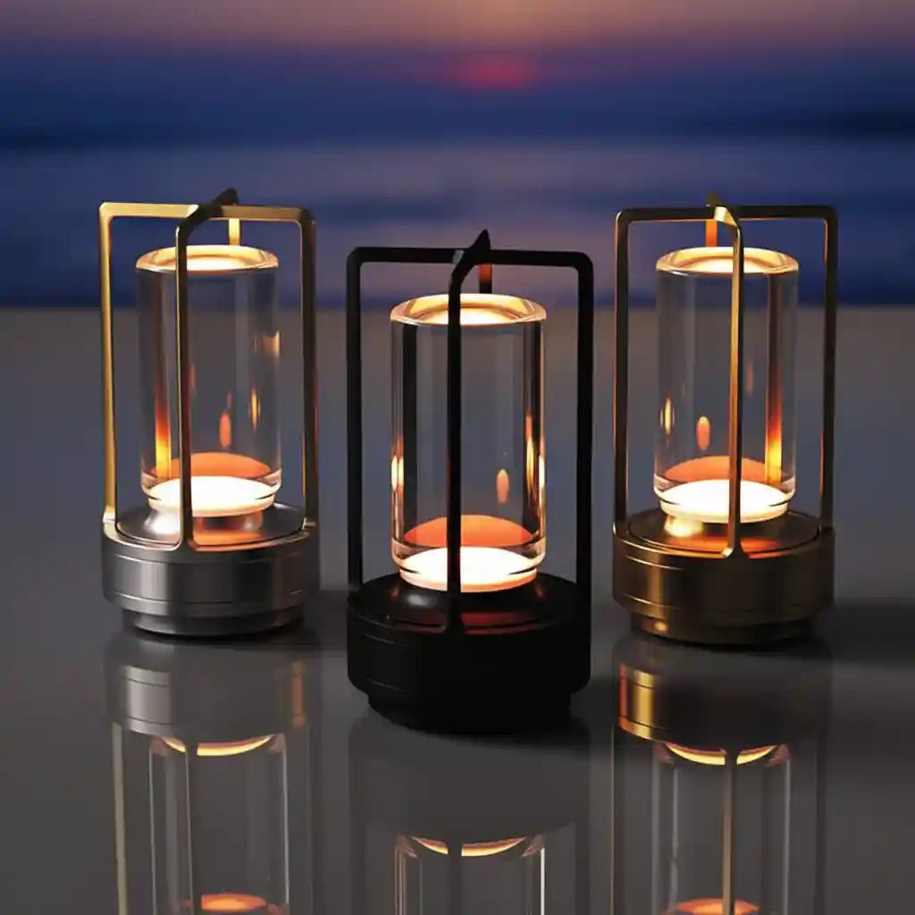 Three candle lanterns with flames against a blurred sunset or sunrise background.